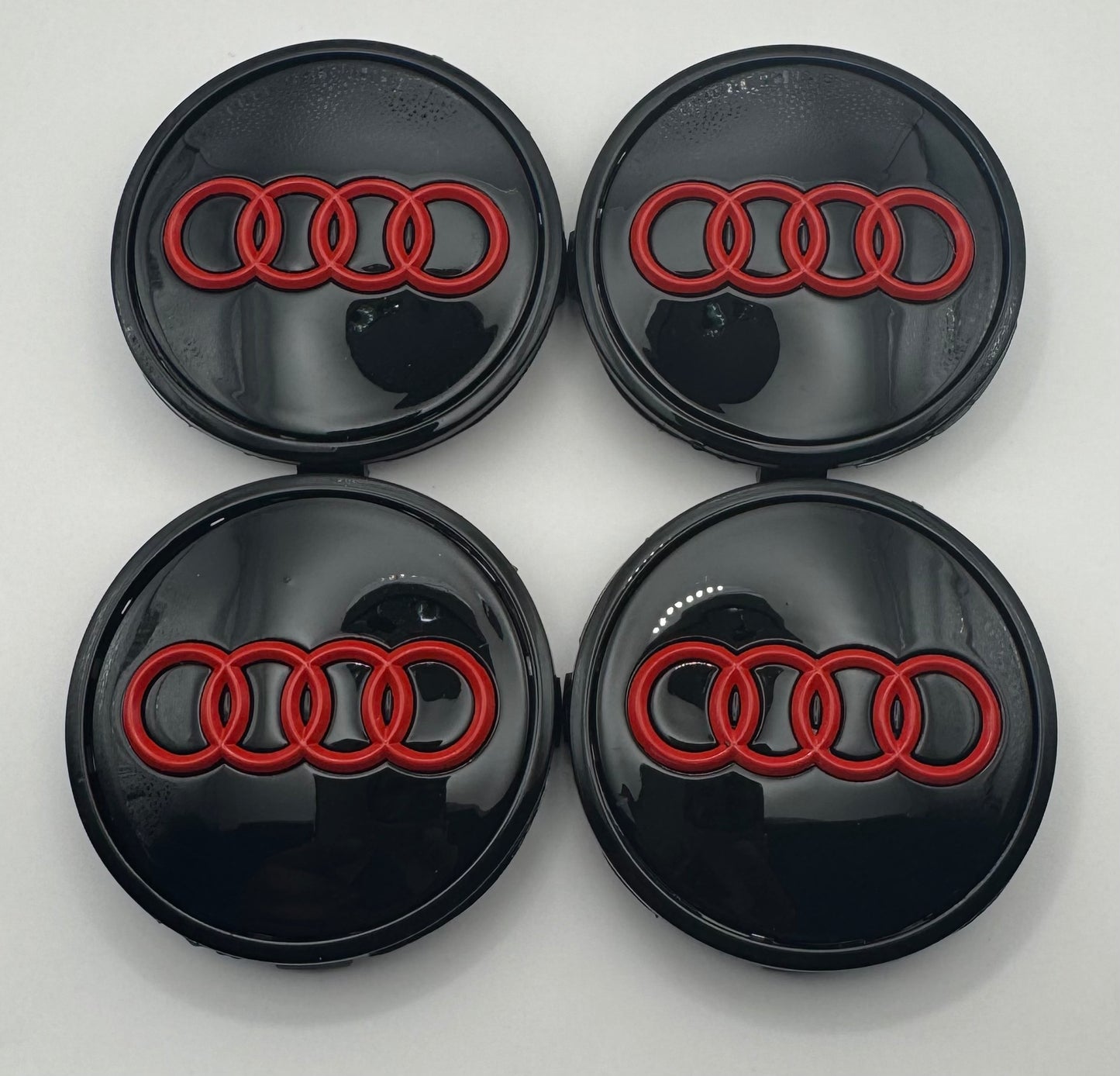 AUDI BLACK RED ALLOY WHEEL CENTRE CAPS (#AMEAU24BLACKRED)