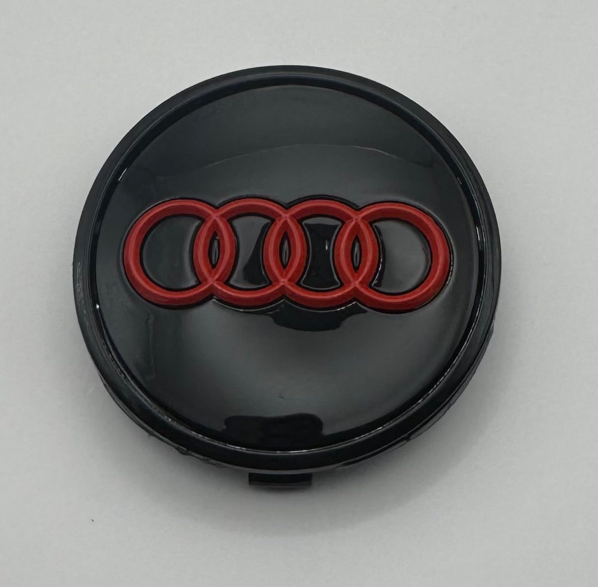 AUDI BLACK RED ALLOY WHEEL CENTRE CAPS (#AMEAU24BLACKRED)
