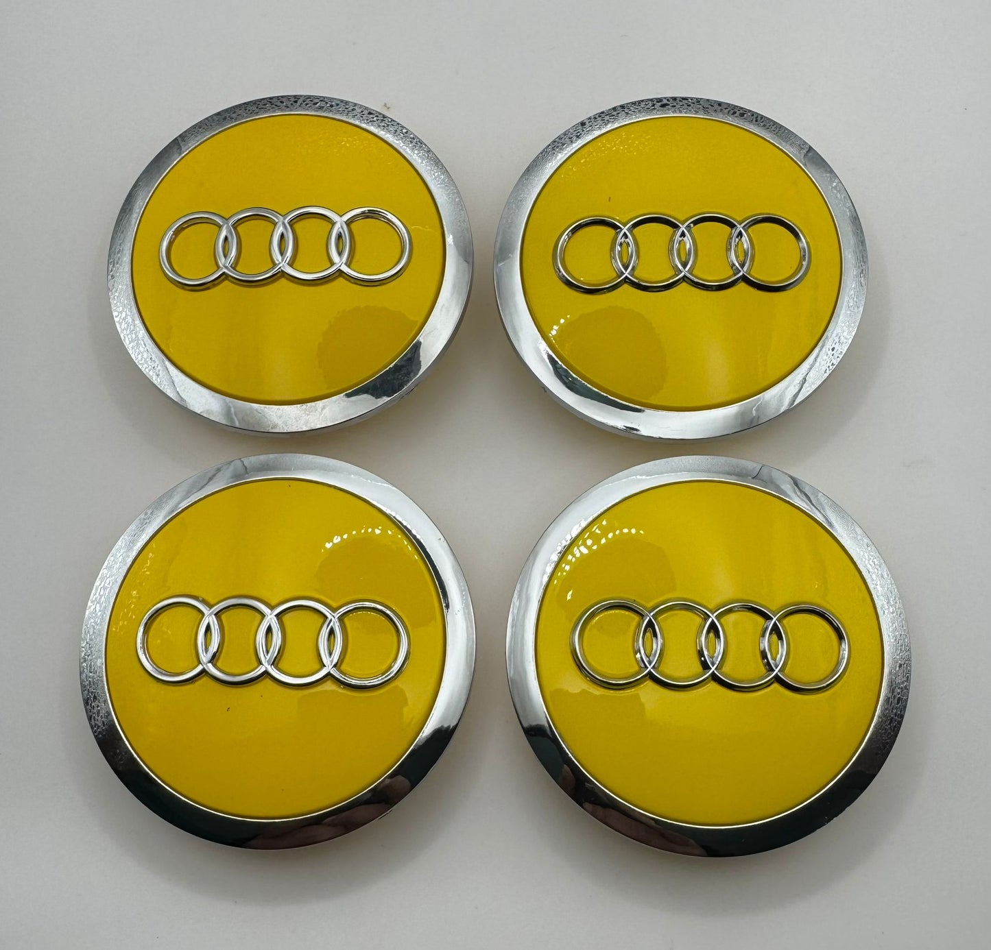 SET OF 4 AUDI YELLOW ALLOY WHEEL CENTRE CAPS WITH CHROME RING 69MM (4B060117A) Fit A3 A4 A5