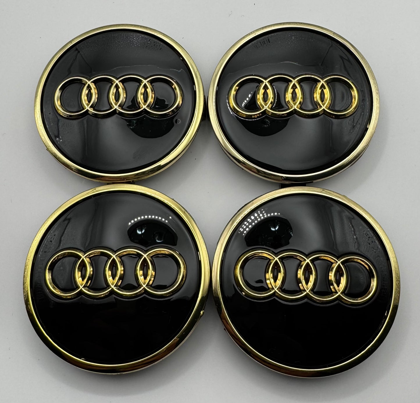 AUDI BLACK GOLD ALLOY WHEEL CENTRE CAPS (#AMEAU16BLACKGOLD)